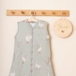 Close-up of the Happy Goose Olive sleeping bag in olive on a hanger