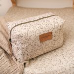 Herbs toiletry bag with a zip fastening and leather label, close-up