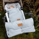 Happy Goose Olive hand muff and footmuff in olive on a pushchair