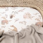 Close-up of Forest Friends woodland animals on the fitted sheet: hedgehog, deer, birds
